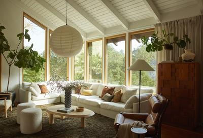 Modern living room with wooden ceiling and natural light